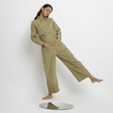 Front View of a Model wearing Khaki Green Vegetable Dyed Handspun Cotton Patch Pocket Wide Legged Pant