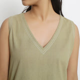 Front Detail of a Model wearing Khaki Green Vegetable Dyed Handspun Cotton Sleeveless Crop Top