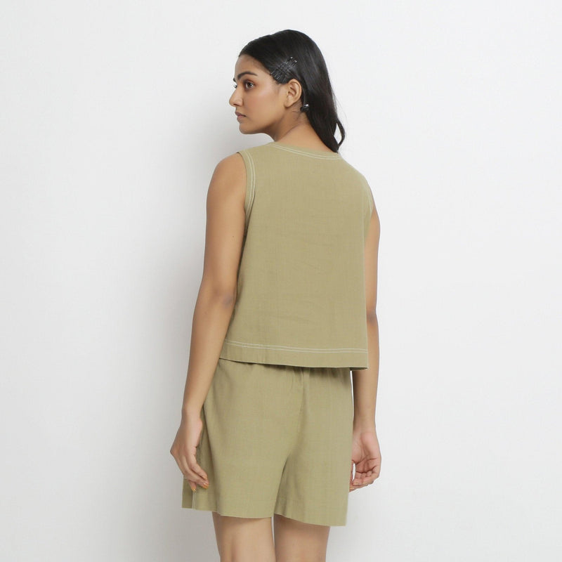 Back View of a Model wearing Khaki Green Vegetable Dyed Handspun Cotton Sleeveless Crop Top