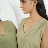 Front Detail of a Model wearing Khaki Green Vegetable Dyed Handspun Cotton Sleeveless Crop Top