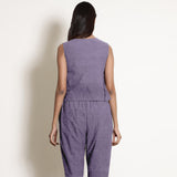 Back View of a Model wearing Lavender 100% Linen V-Neck Flared Godet Top