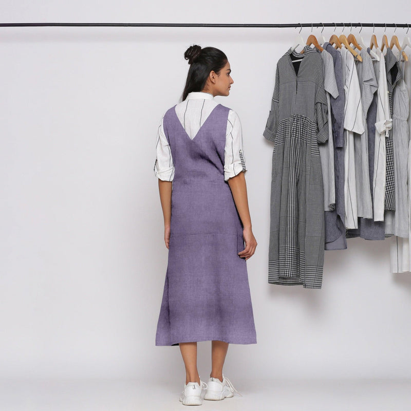 Back View of a Model wearing Lavender 100% Linen V-Neck Midi Pinafore Dress