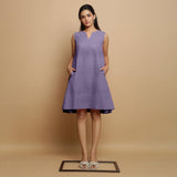 Front View of a Model wearing Lavender Linen Embroidered Knee-Length Godet Dress