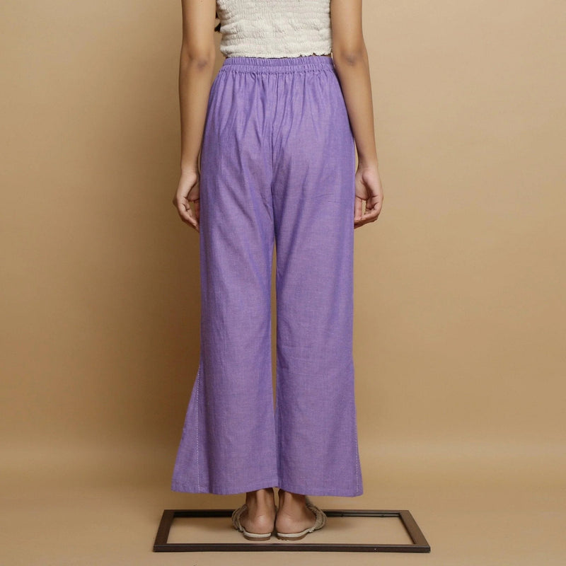 Back View of a Model wearing Lavender Ankle-Length Godet Pant