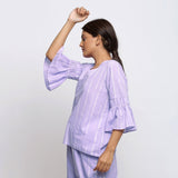 Left View of a Model wearing Lavender Hand Tie Dyed A-Line Top