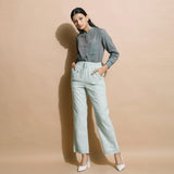 Front View of a Model wearing Light Green Checkered Cotton Muslin Elasticated Mid-Rise Pant