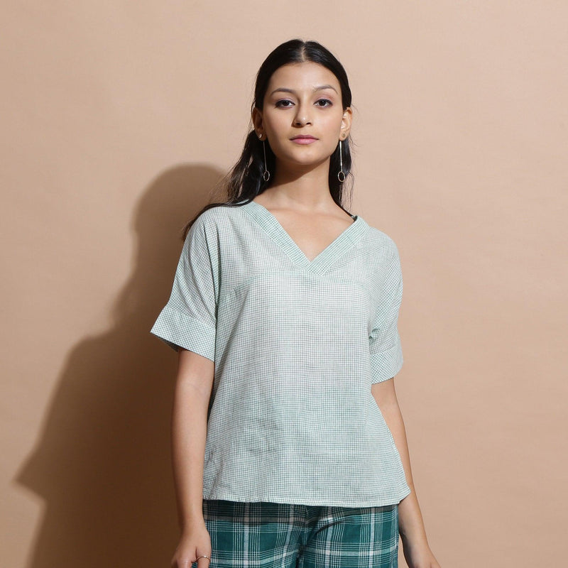 Front View of a Model wearing Light Green Checks Handspun Cotton Muslin V-Neck Top