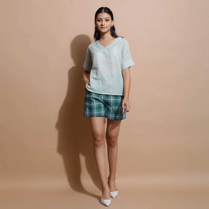 Front View of a Model wearing Light Green Checks Handspun Cotton Muslin V-Neck Top