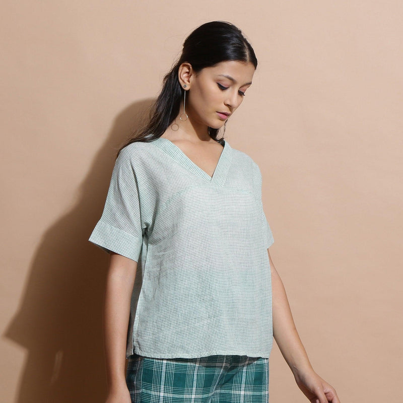 Right View of a Model wearing Light Green Cotton Straight Fit Top