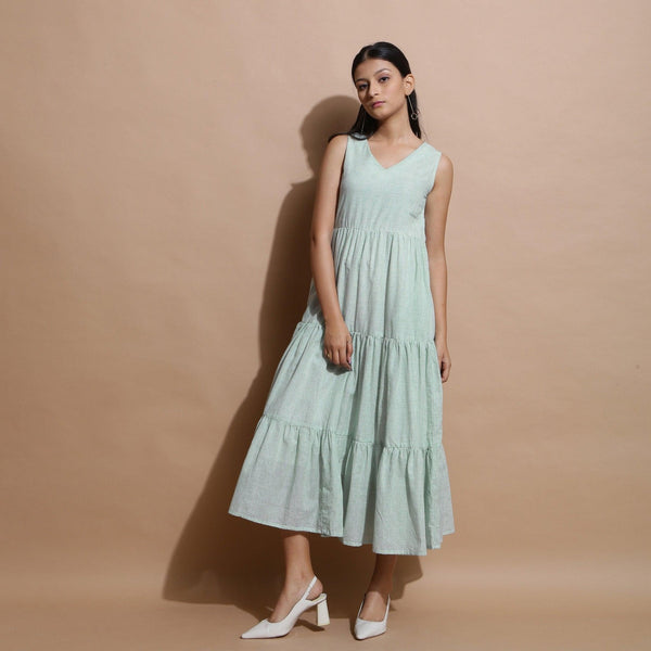 Front View of a Model wearing Light Green Cotton Muslin Checkered Maxi Tier Dress