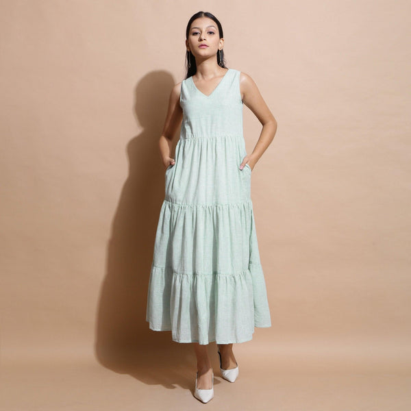 Front View of a Model wearing Light Green Cotton Muslin Checkered Maxi Tier Dress