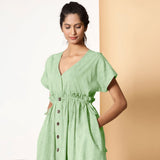 Left View of a Model wearing Bohemian Cotton Light Green Frilled Dress