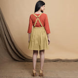 Back View of a Model wearing Light Khakhi Cotton Flax Knee Length Criss-Cross Back Dress