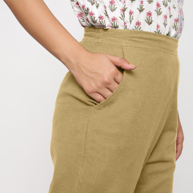 Right Detail of a Model wearing Cotton Flax Mid-Rise Light Khaki Tapered Pant