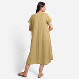 Back View of a Model wearing Light Khaki Cotton Welt Pocket Shift Dress