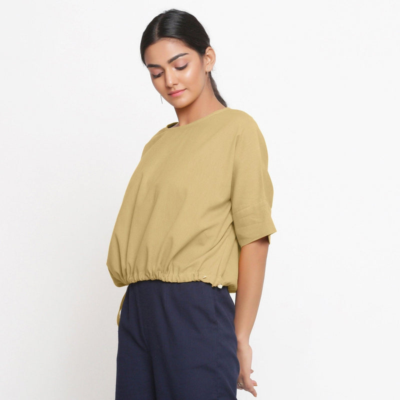 Left View of a Model wearing Light Khaki Cotton Flax Blouson Top