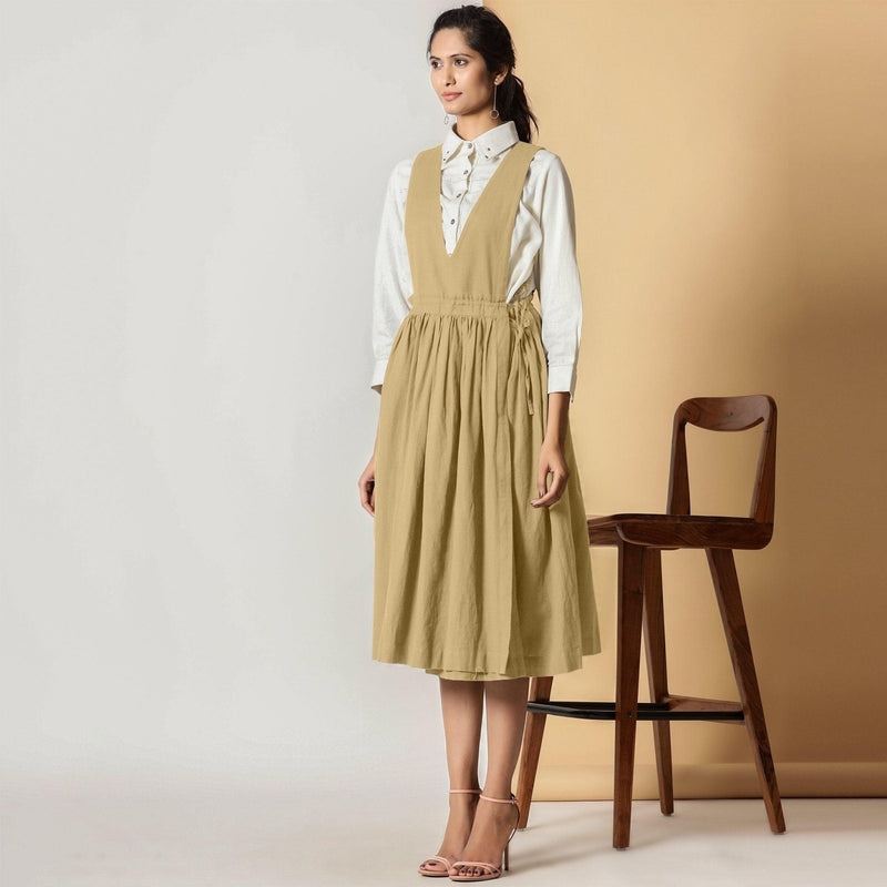 Left View of a Model wearing Light Khakhi Cotton Flax Pinafore Midi Wrap Dress