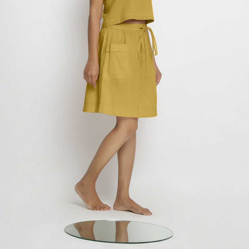 Right View of a Model wearing Vegetable-Dyed Light Yellow 100% Cotton Mid-Rise Skirt