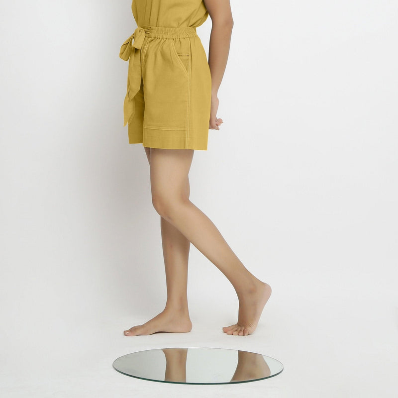 Left View of a Model wearing Yellow Vegetable Dyed Handspun Short Shorts