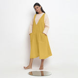 Left View of a Model wearing Light Yellow Handspun Cotton Deep Neck Shift Dress