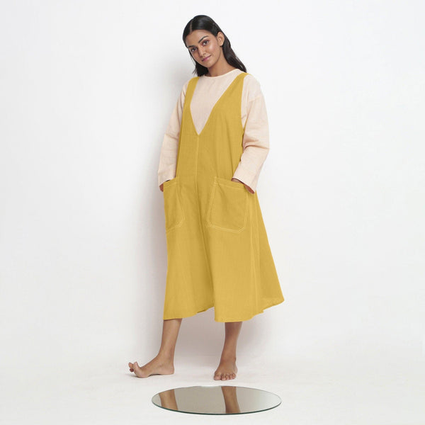 Left View of a Model wearing Light Yellow Handspun Cotton Deep Neck Shift Dress