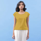 Front View of a Model wearing Light Yellow Vegetable Dyed Handspun Cotton Essential Top