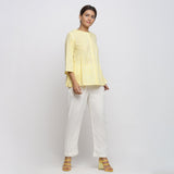 Right View of a Model wearing Light Yellow Cotton Button-Down Top