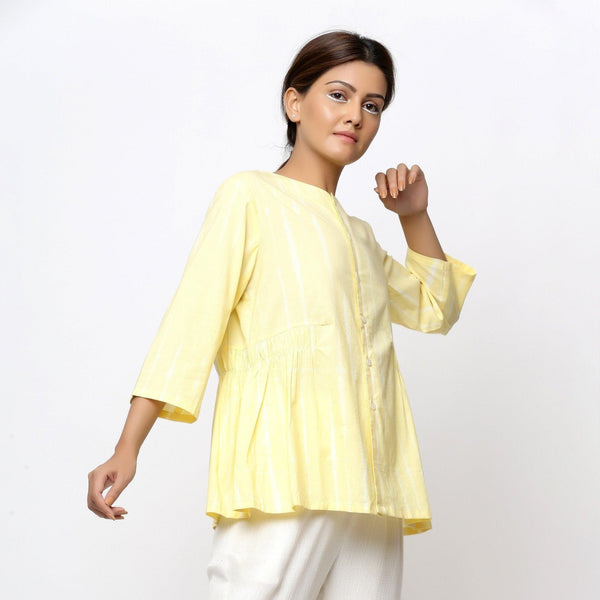 Right View of a Model wearing Light Yellow Cotton Button-Down Top