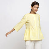 Front View of a Model wearing Light Yellow Cotton Button-Down Top