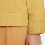 Front Detail of a Model wearing Yellow Vegetable-Dyed 100% Cotton Straight Top