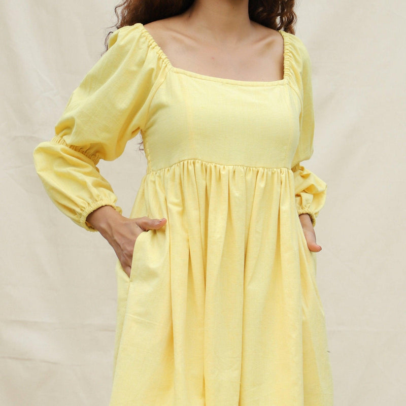 Front Detail of a Model wearing Light Yellow Handspun Cotton Bohemian Gathered Short Dress