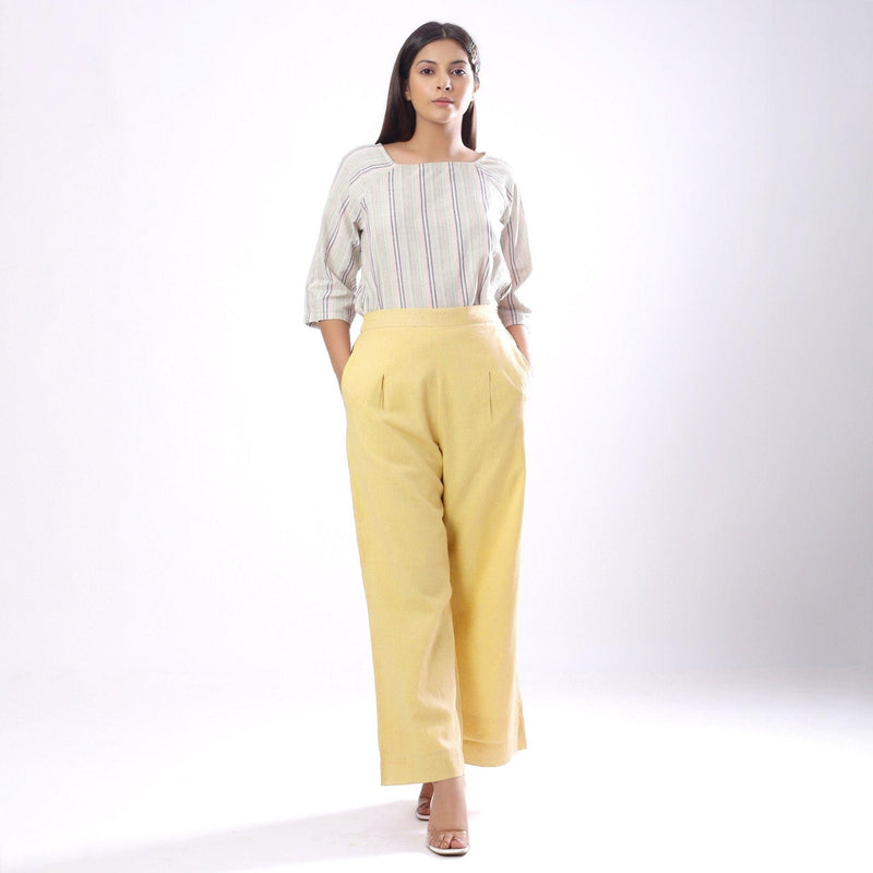 Front View of a Model wearing Handspun Light Yellow Wide Legged Pant