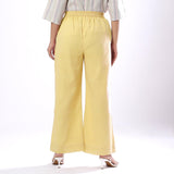 Back View of a Model wearing Handspun Light Yellow Wide Legged Pant