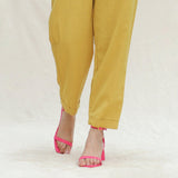 Close View of a Model wearing Mustard Handspun Cotton High-Rise Elasticated Paperbag Pant