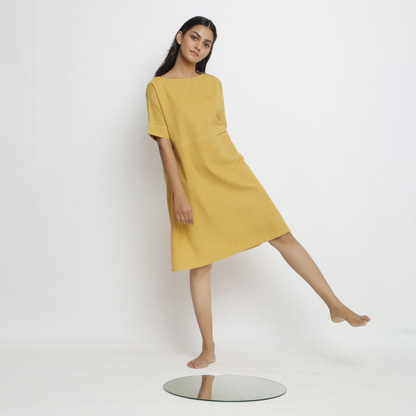 Front View of a Model wearing Lemon Yellow Vegetable Dyed Handspun Cotton Knee Length Yoked Dress