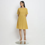 Front View of a Model wearing Lemon Yellow Vegetable Dyed Handspun Cotton Knee Length Yoked Dress