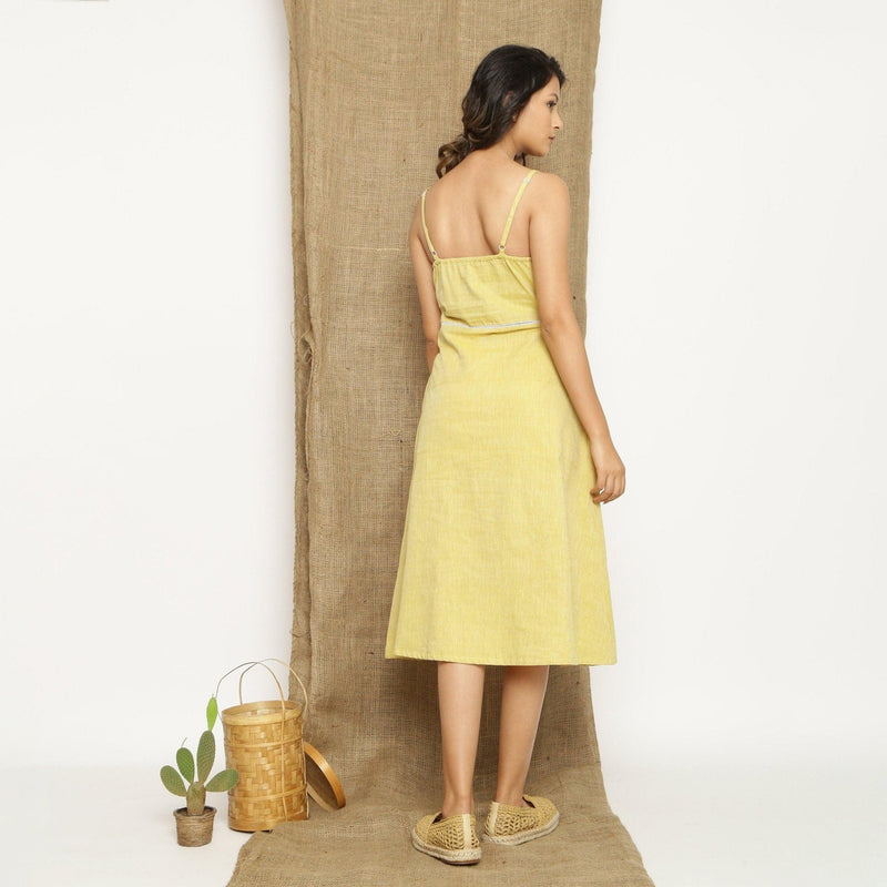 Back View of a Model wearing Light Yellow Handspun Cotton Lace Camisole Dress