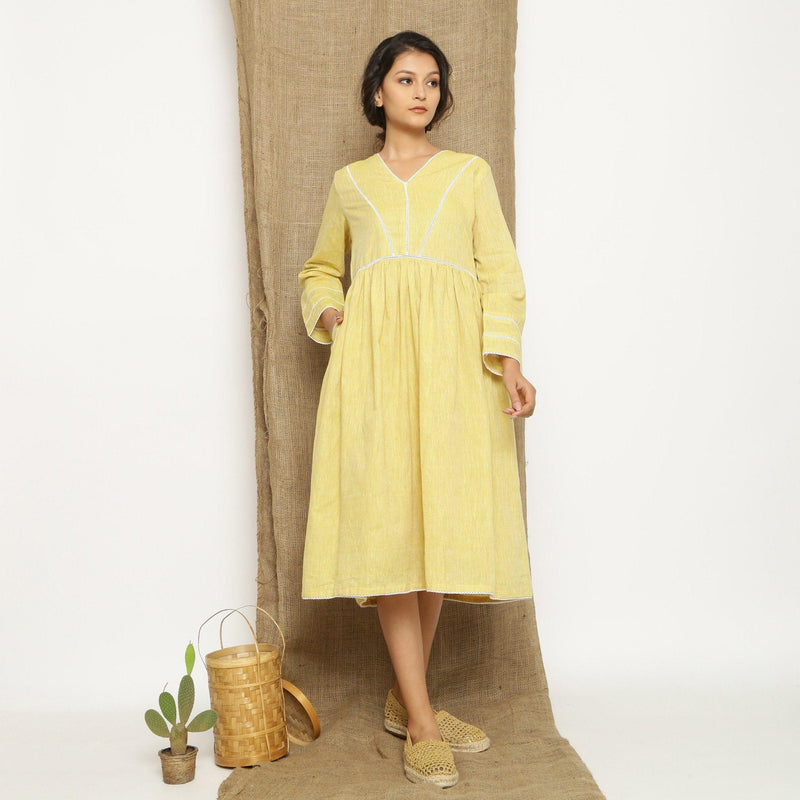 Front View of a Model wearing Handspun Light Yellow Gathered Dress