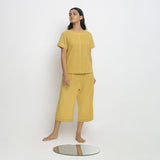 Front View of a Model wearing Breezy Light Yellow Top and Culottes Set