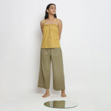 Front View of a Model wearing Light Yellow Patch Pocket Vegetable Dyed Handspun Cotton Camisole Top