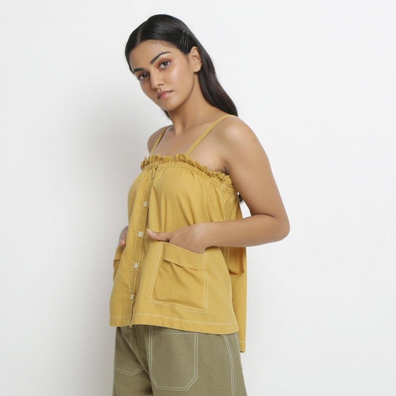 Left View of a Model wearing Light Yellow Patch Pocket Vegetable Dyed Handspun Cotton Camisole Top