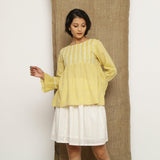 Front View of a Model wearing Handspun Light Yellow Poet Sleeve Top