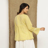 Back View of a Model wearing Handspun Light Yellow Poet Sleeve Top