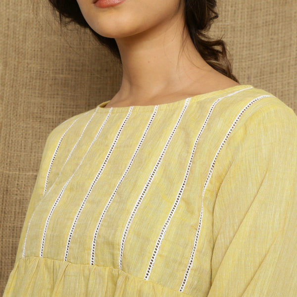 Front Detail of a Model wearing Handspun Light Yellow Poet Sleeve Top