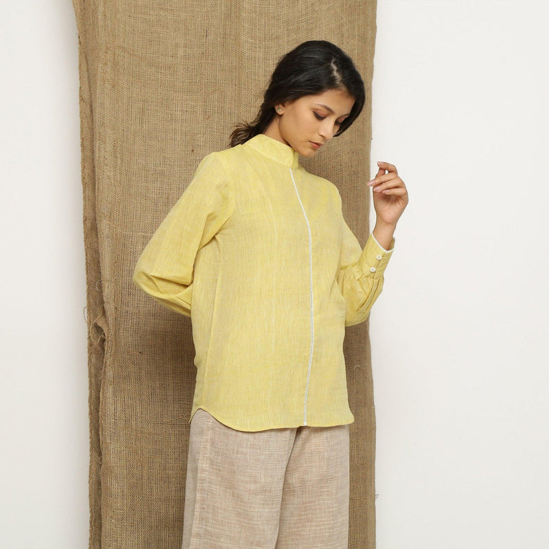 Right View of a Model wearing Light Yellow Handspun Halter Neck Top