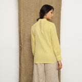 Back View of a Model wearing Light Yellow Handspun Halter Neck Top