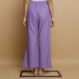 Back View of a Model wearing Lavender Ankle-Length Godet Pant