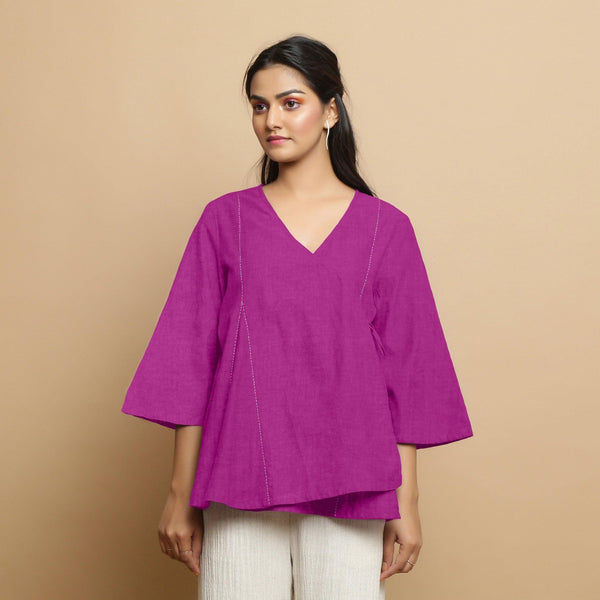 Front View of a Model wearing Magenta Embroidered Linen Asymmetrical Godet Top