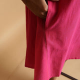 Right Detail of a Model wearing Magenta Hand-Embroidered Godet Dress