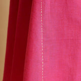 Close View of a Model wearing Magenta Hand-Embroidered Godet Dress